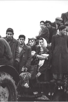 Hungarian refugees gathered on a tractor in 1956.