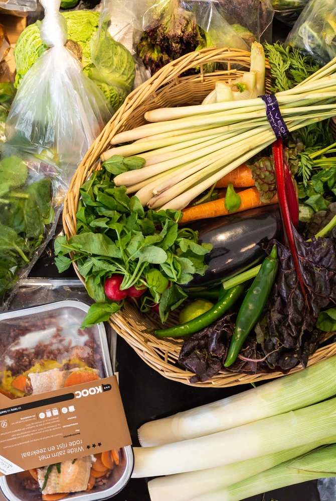 A colourful assortment of fresh vegetables and surplus food gathered for cooking.