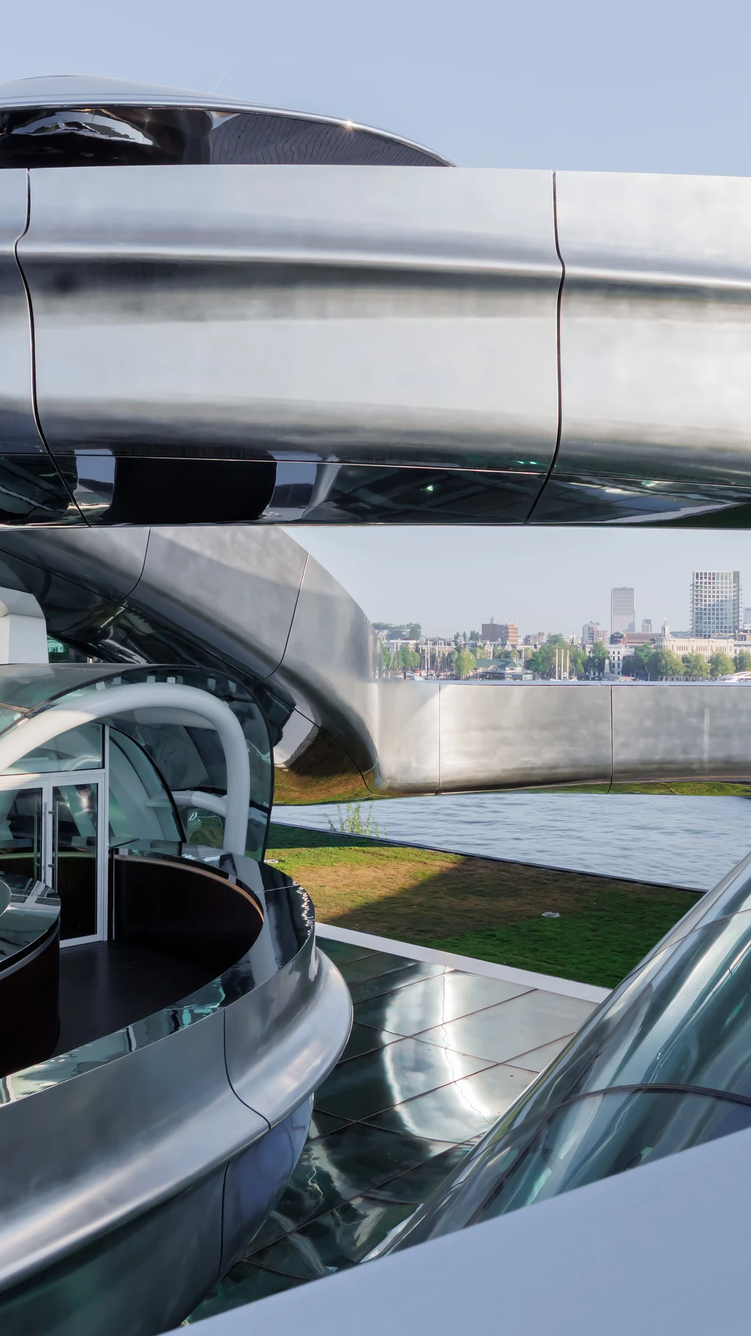 Futuristic architecture featuring curved metallic structures and glass domes.