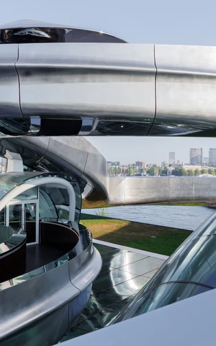 Futuristic architecture featuring curved metallic structures and glass domes.
