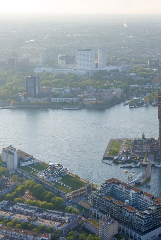 Een vogelvlucht zicht op fenix en de wijk, waar je katendrecht, de maas, en de kop van zuid ziet.