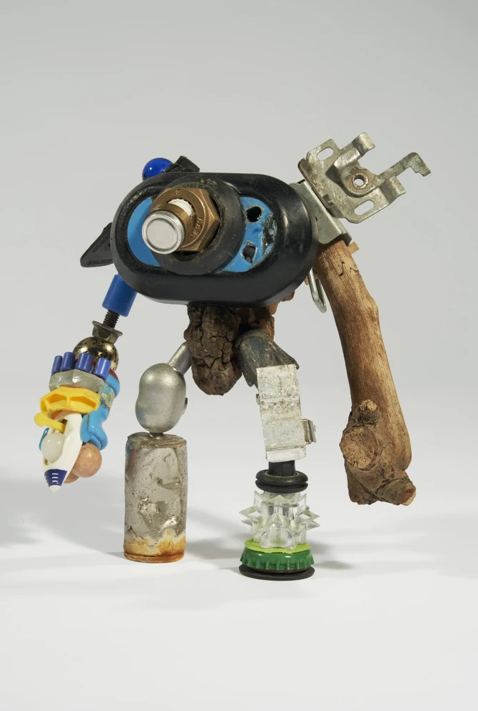 A quirky robot sculpture made from mixed materials