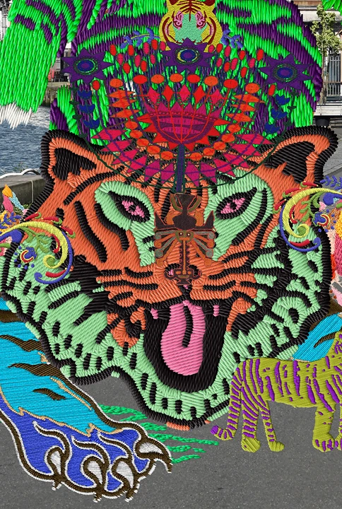 A vibrant embroidery of a tiger with colorful wings appears on a riverside street.