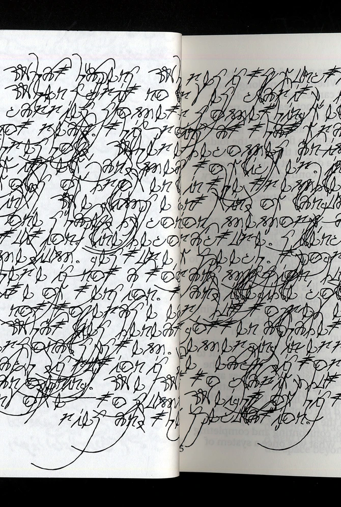 An open book filled with dense, abstract handwritten symbols in black ink.
